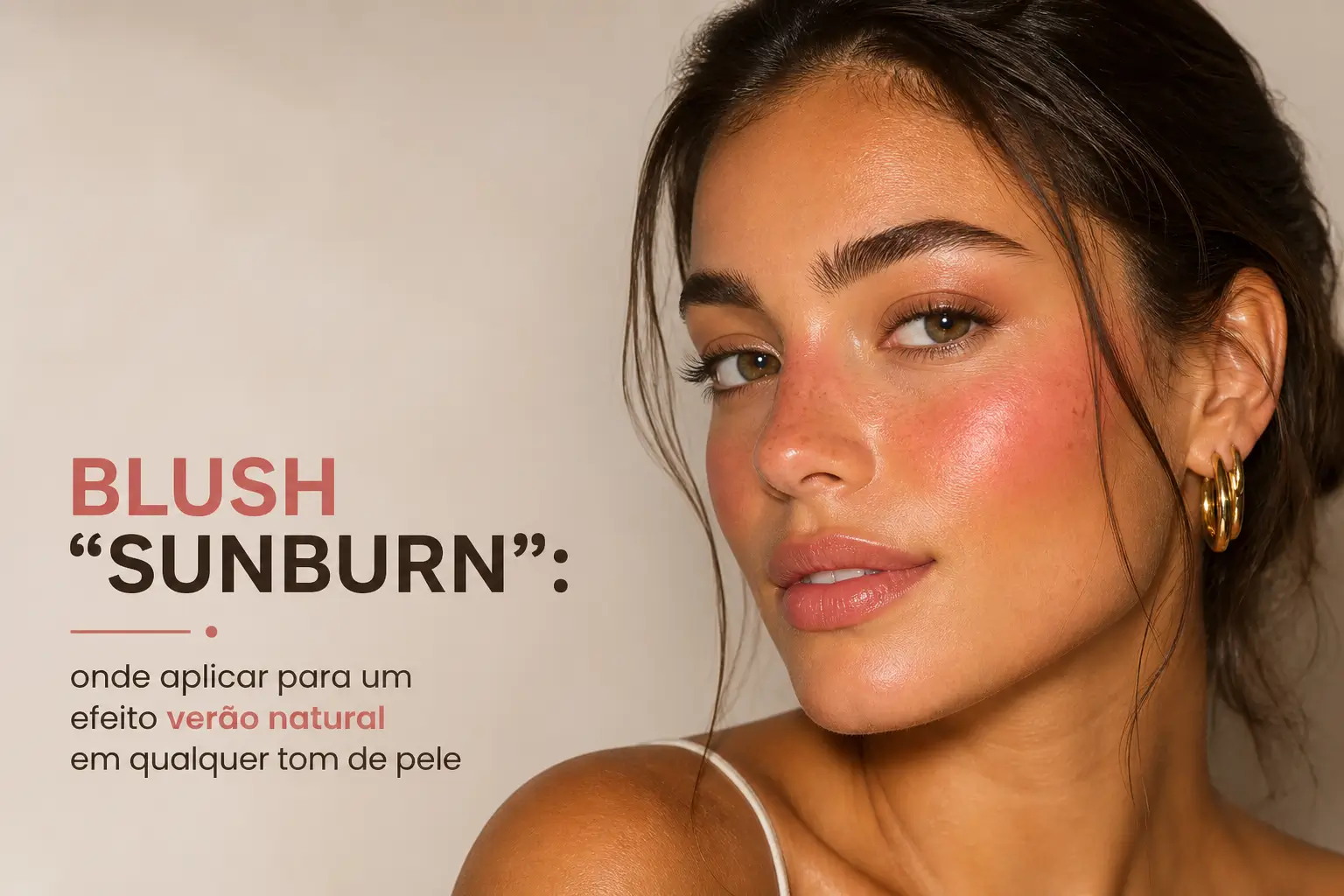 Modelo com pele iluminada e blush sunburn, cabelo preso
